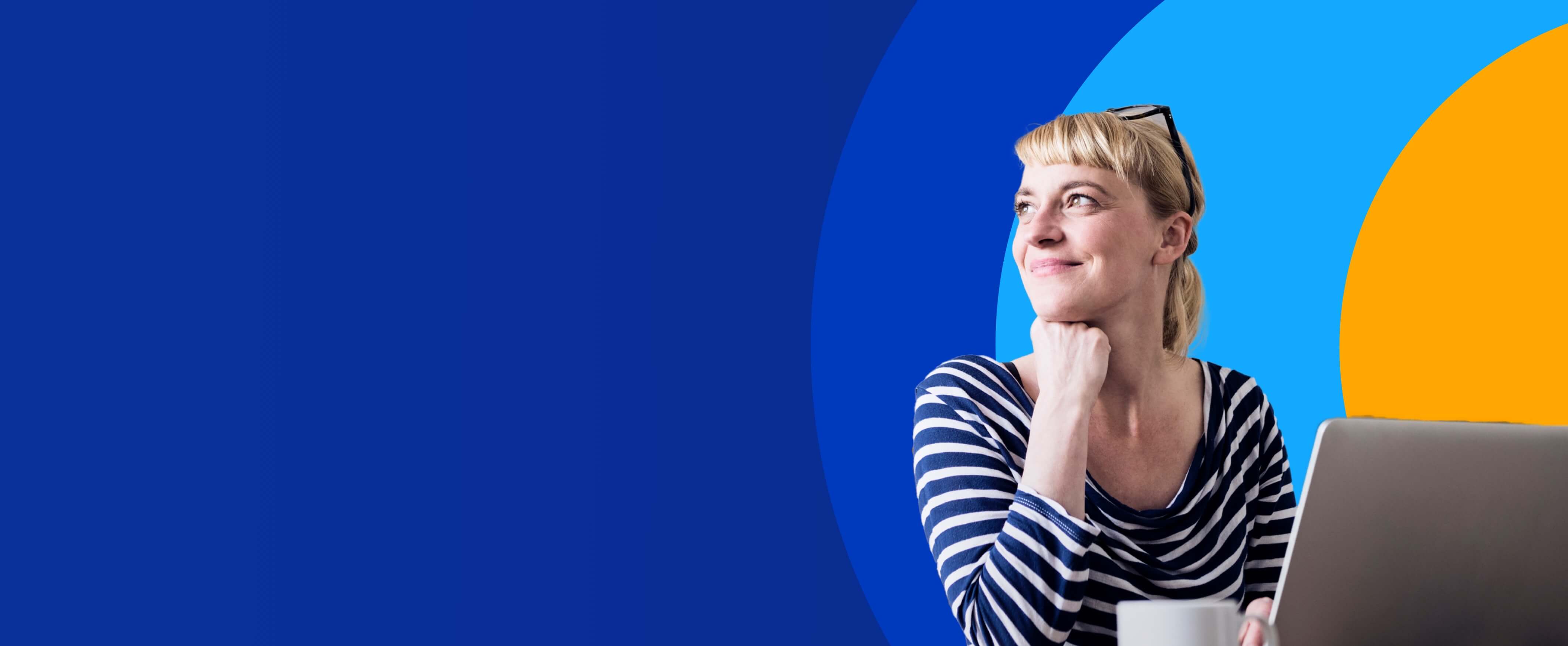 woman smiling in front of laptop