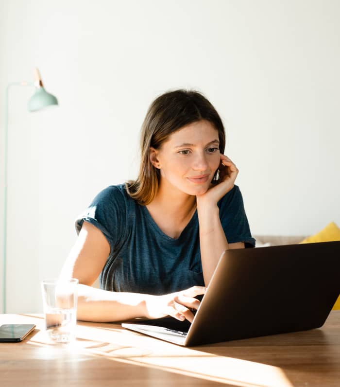 Smiling woman at laptop