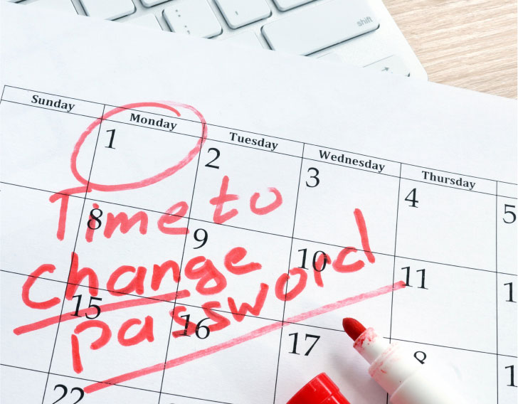 calendar with hand written reminder to change password on the first of the month